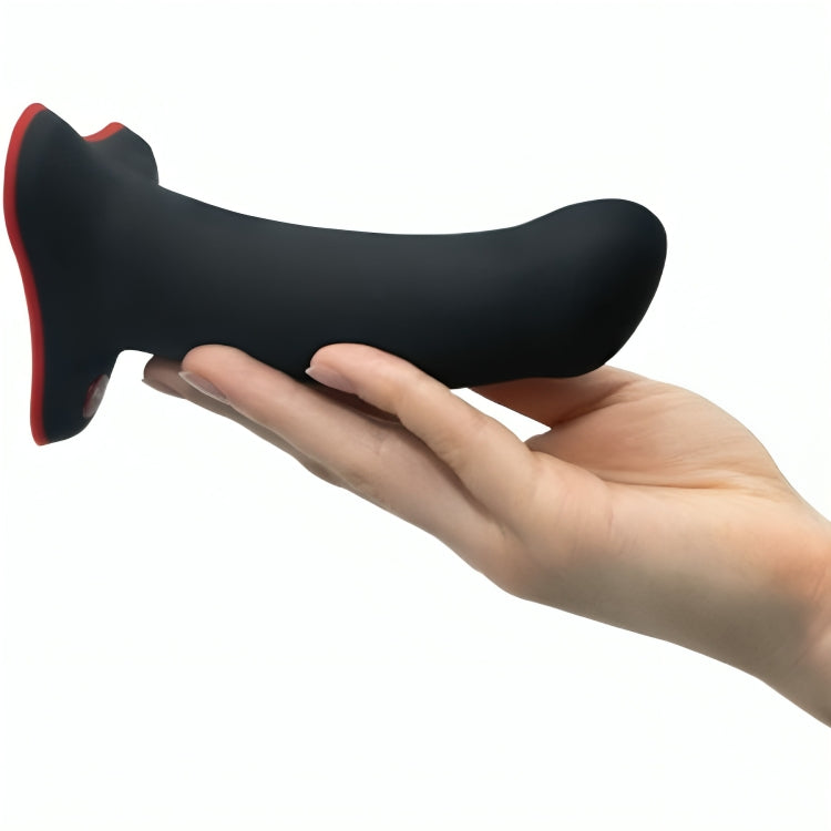 Présentation du gode amor noir tenu dans une main