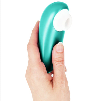 Stimulateur clitoridien sans contact vert émeraude à embout blanc en silicone, tenu en main