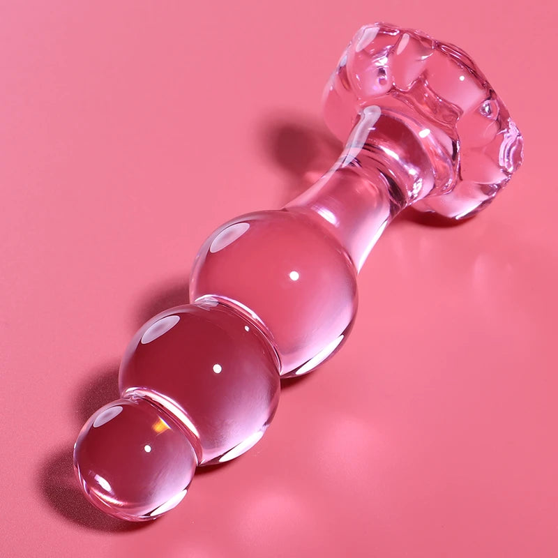 Plug anal en verre rose avec boules progressives et base décorative sécurisée 
