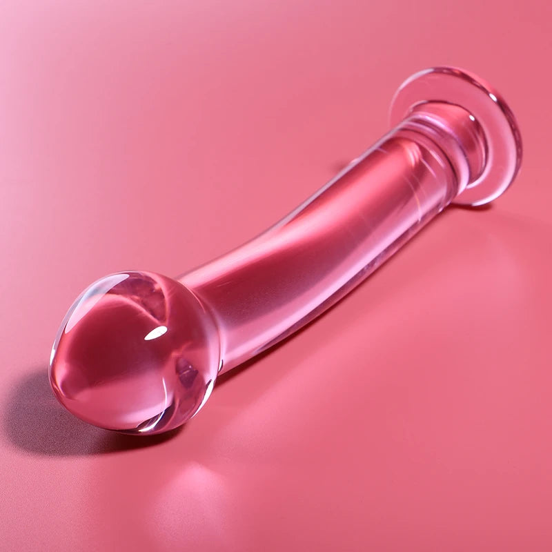  Gode 16 cm en verre rose – texture lisse et tête réaliste allongé sur fond rose