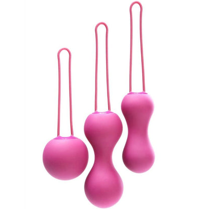 Lot de trois boules de Kegel roses en silicone avec cordon de retrait vue de face sur fond blanc