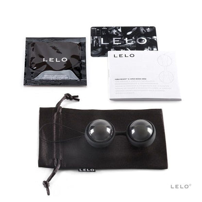 Coffret LELO ouvert avec boules noires, cordon, pochette et documentation